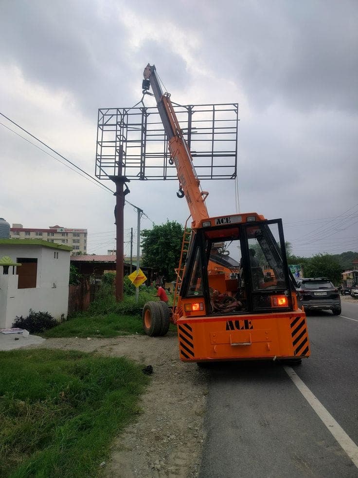 Crane lifting a structure into position on a construction site