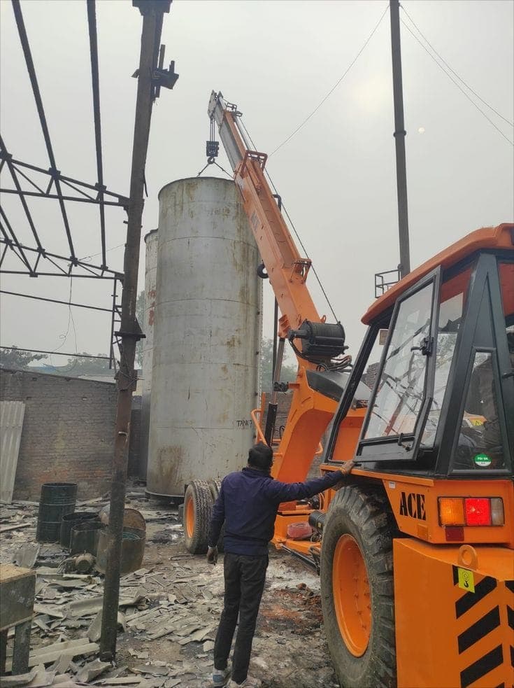 Crane lifting an industrial tank at a site in Ludhiana
